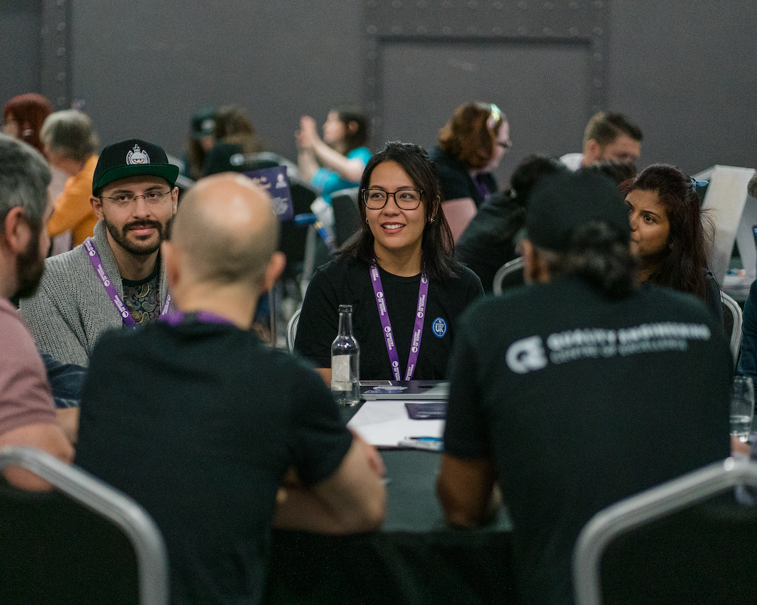 People gathered around a table having a deep discussion.